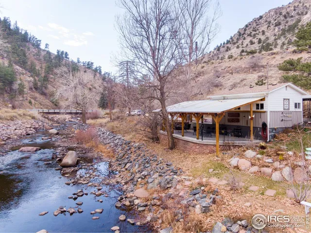a room with wooden floor and windows