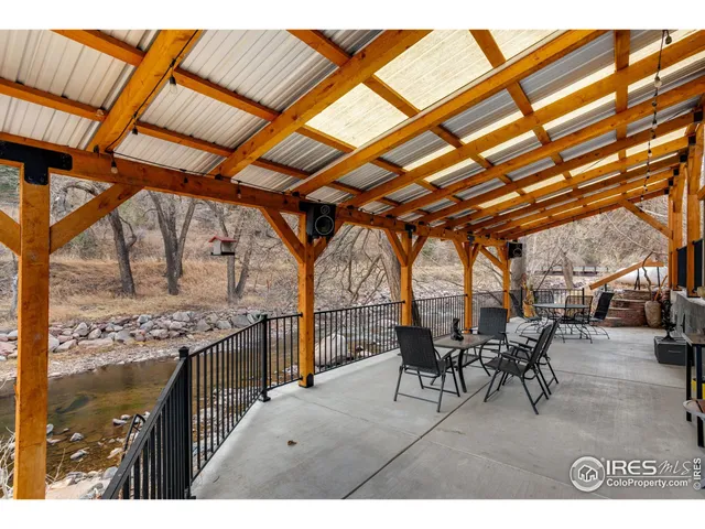 a bedroom with a bed a chandelier and closet