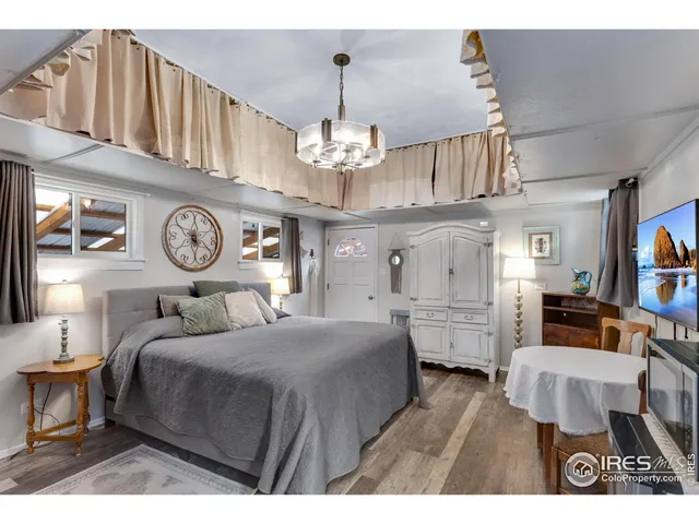 a living room with fireplace furniture and a chandelier