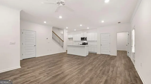 a view of kitchen and wooden floor