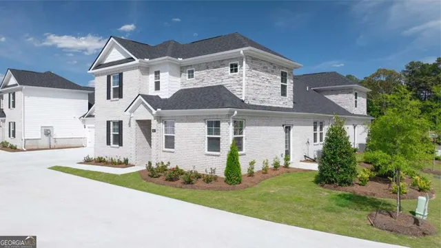front view of a house with a yard