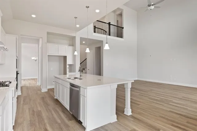 a kitchen with a sink and cabinets