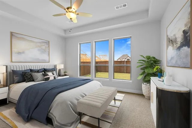 a spacious bedroom with a bed and a window