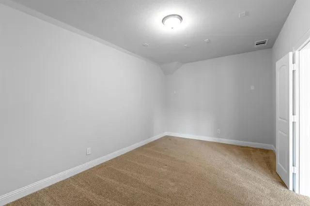 an empty room with a empty space and window