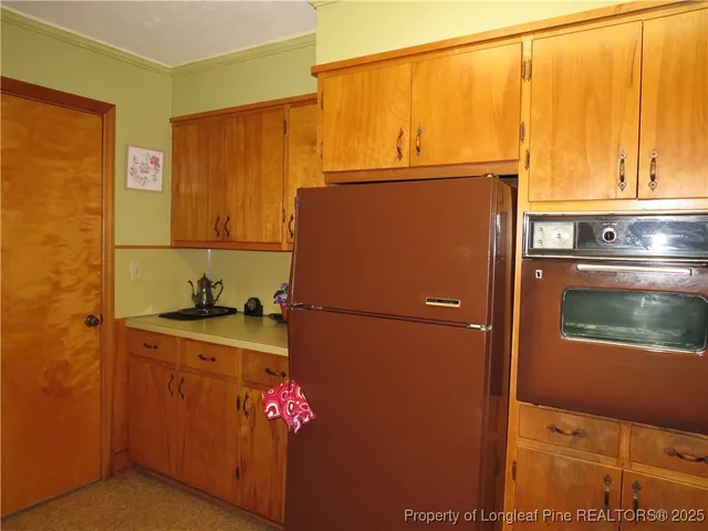 a white refrigerator freezer sitting inside of a kitchen