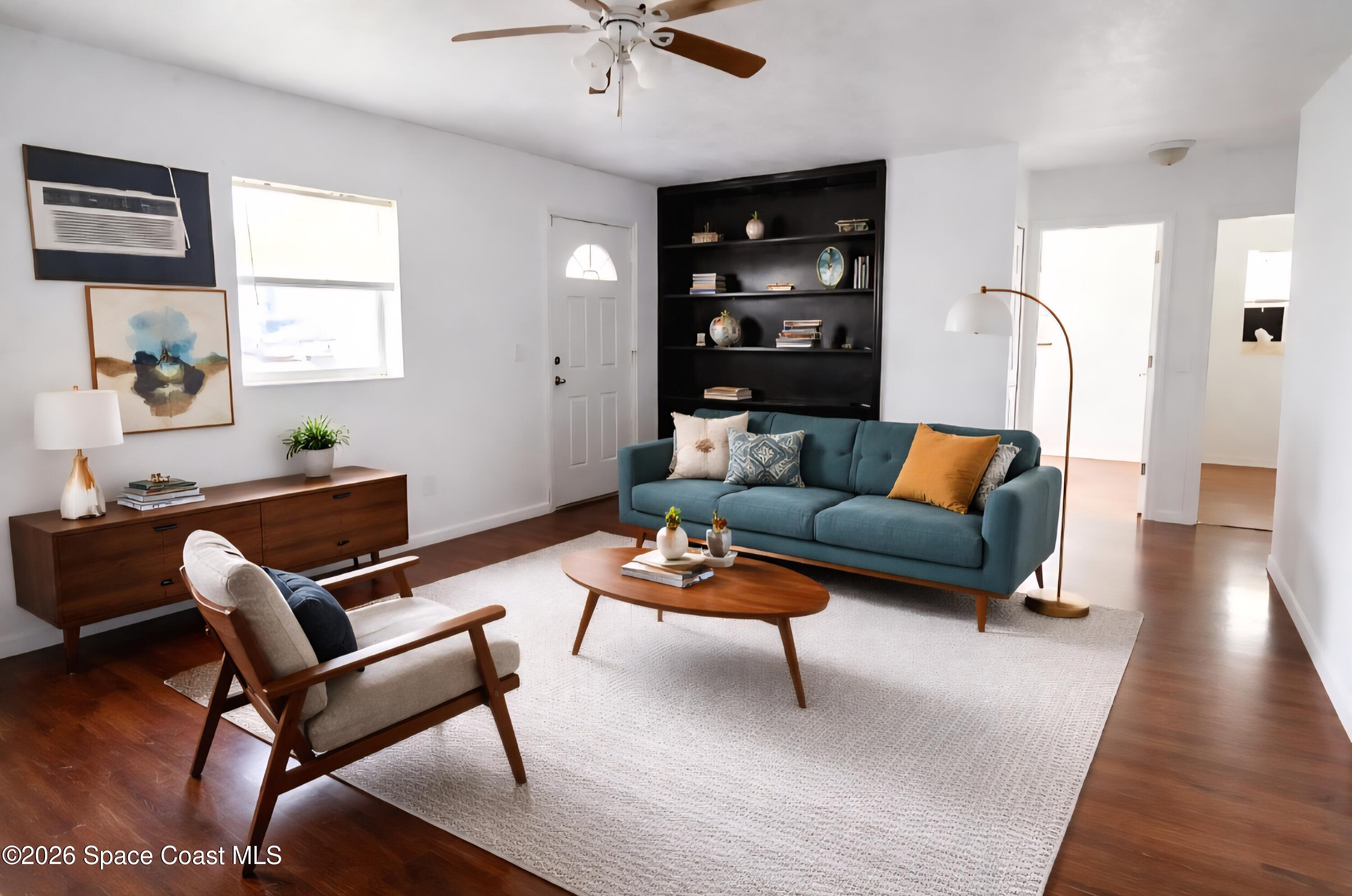 1026 Bacon Circle Northeast, Unit A Palm Bay, FL 32905 - Photo 5 of 12 a living room with furniture and a window