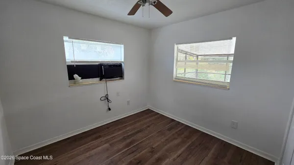 a view of an empty room with a large window