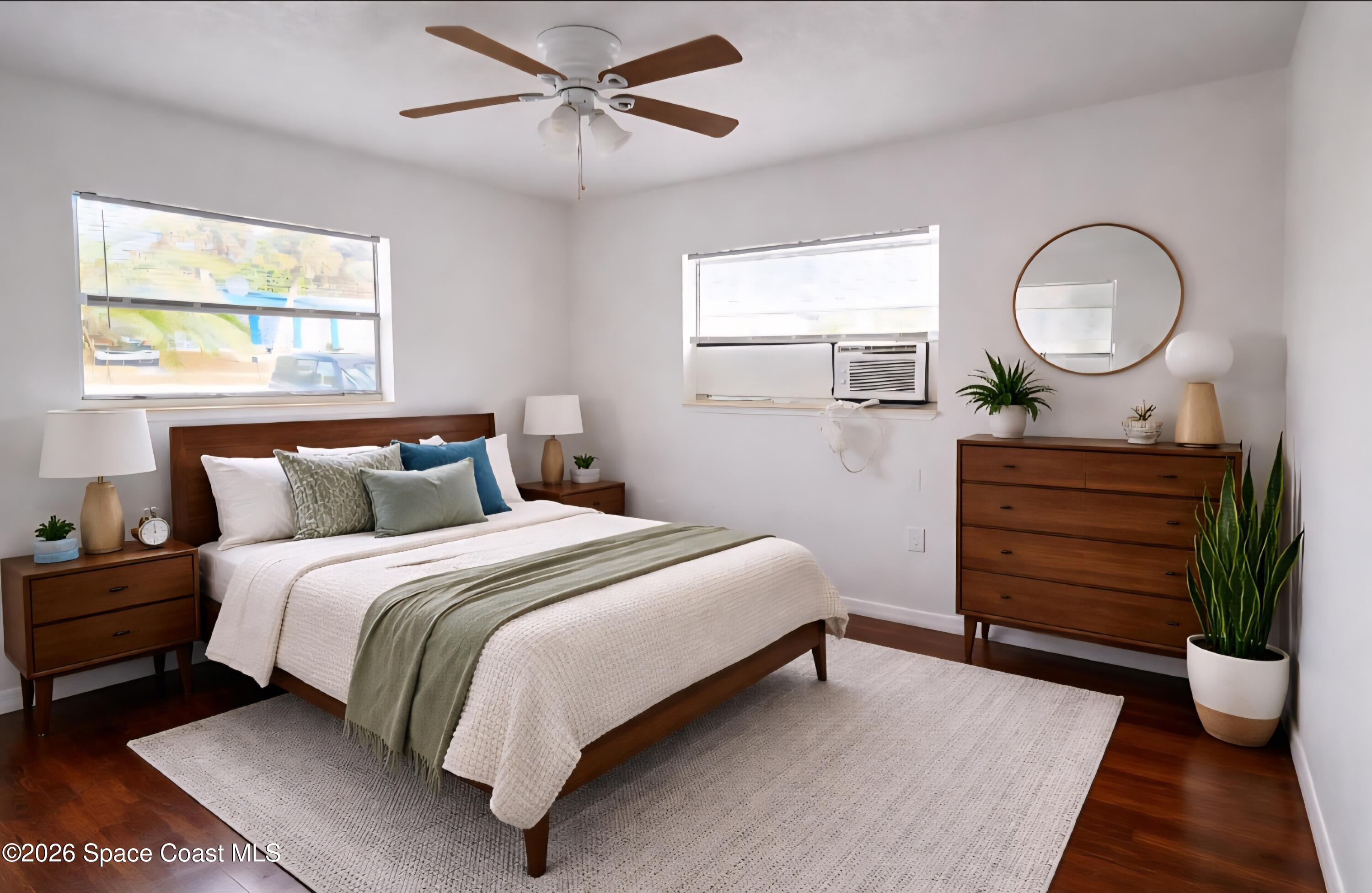 1026 Bacon Circle Northeast, Unit A Palm Bay, FL 32905 - Photo 9 of 12 a bedroom with a bed and a dresser