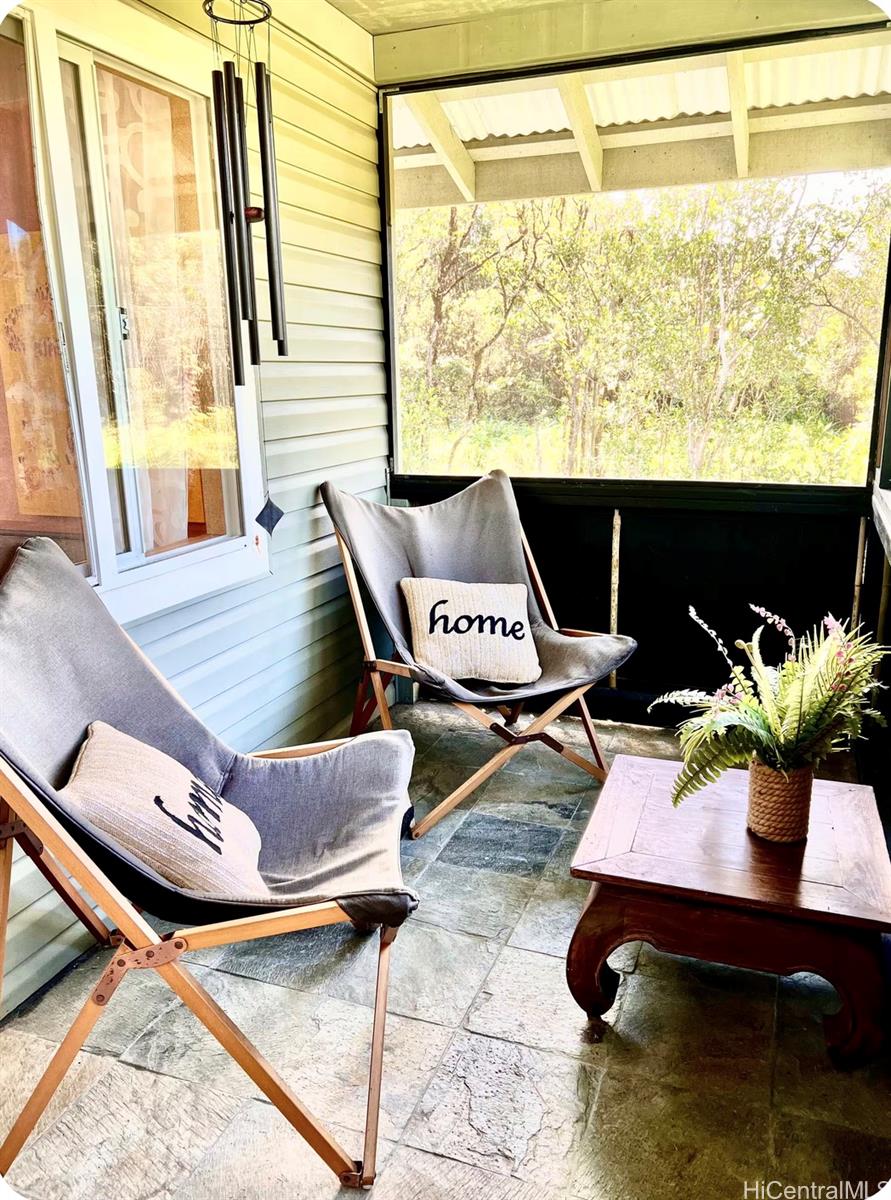 18-4011 Makuahine Road Mountain View, HI 96771 - Photo 17 of 24 a view of living room with furniture and floor to ceiling window