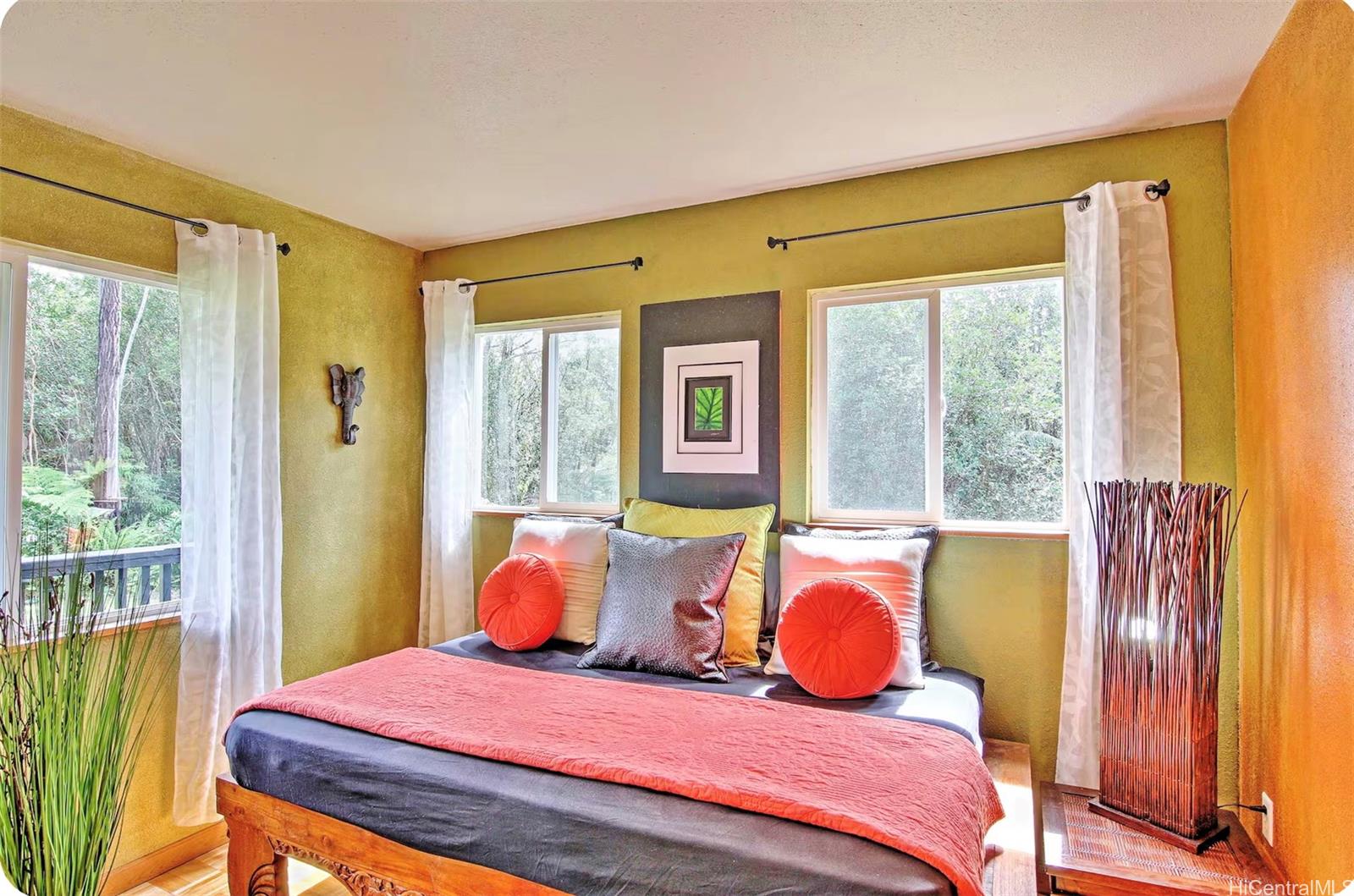 18-4011 Makuahine Road Mountain View, HI 96771 - Photo 5 of 24 a bedroom with a bed and wooden floor