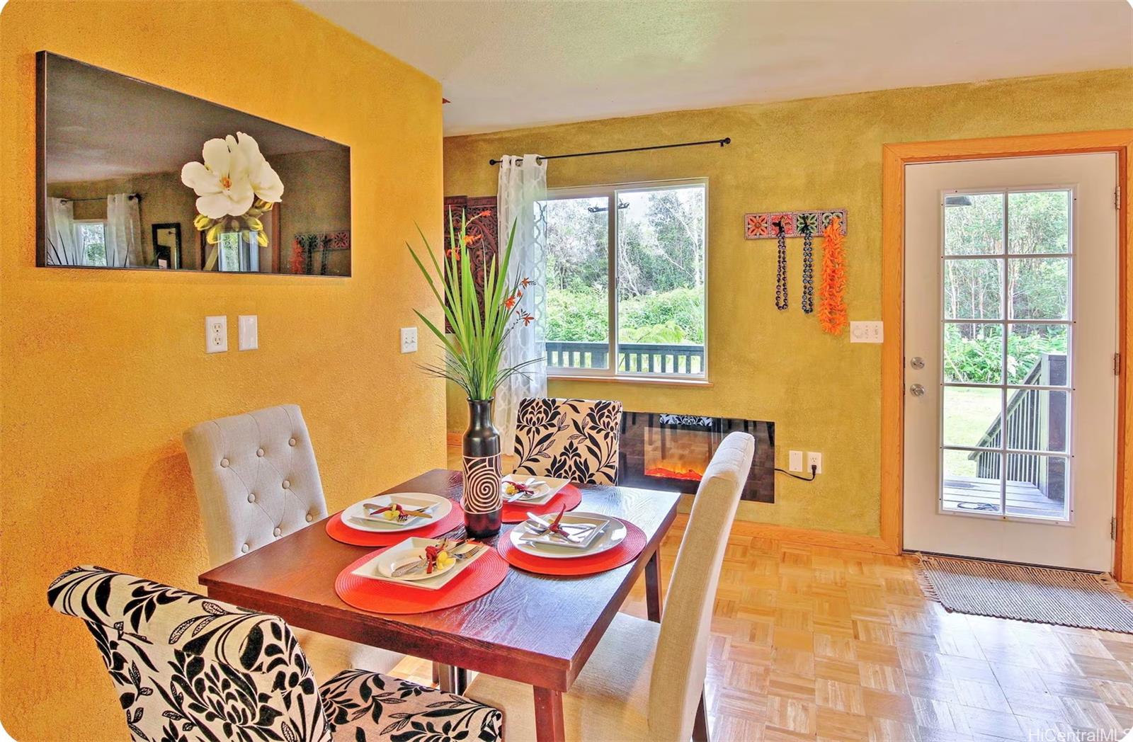 18-4011 Makuahine Road Mountain View, HI 96771 - Photo 9 of 24 a dining room with furniture and a window