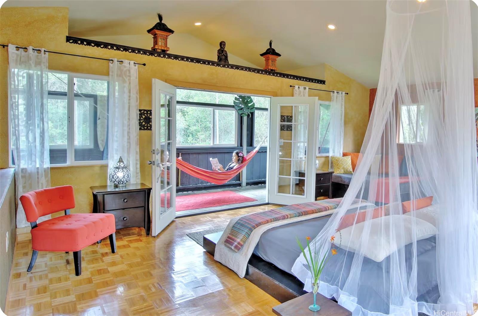 18-4011 Makuahine Road Mountain View, HI 96771 - Photo 10 of 24 a bedroom with furniture and a window