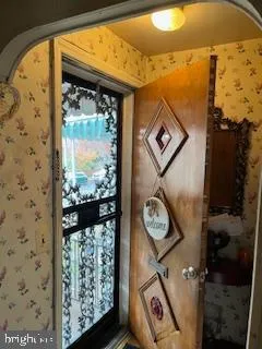 a view of a livingroom with furniture and a window