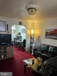 a kitchen with sink refrigerator and dining table