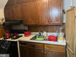3330 Clay Street Northeast Washington, DC 20019 - Photo 8 of 14 a kitchen with a sink cabinets and appliances