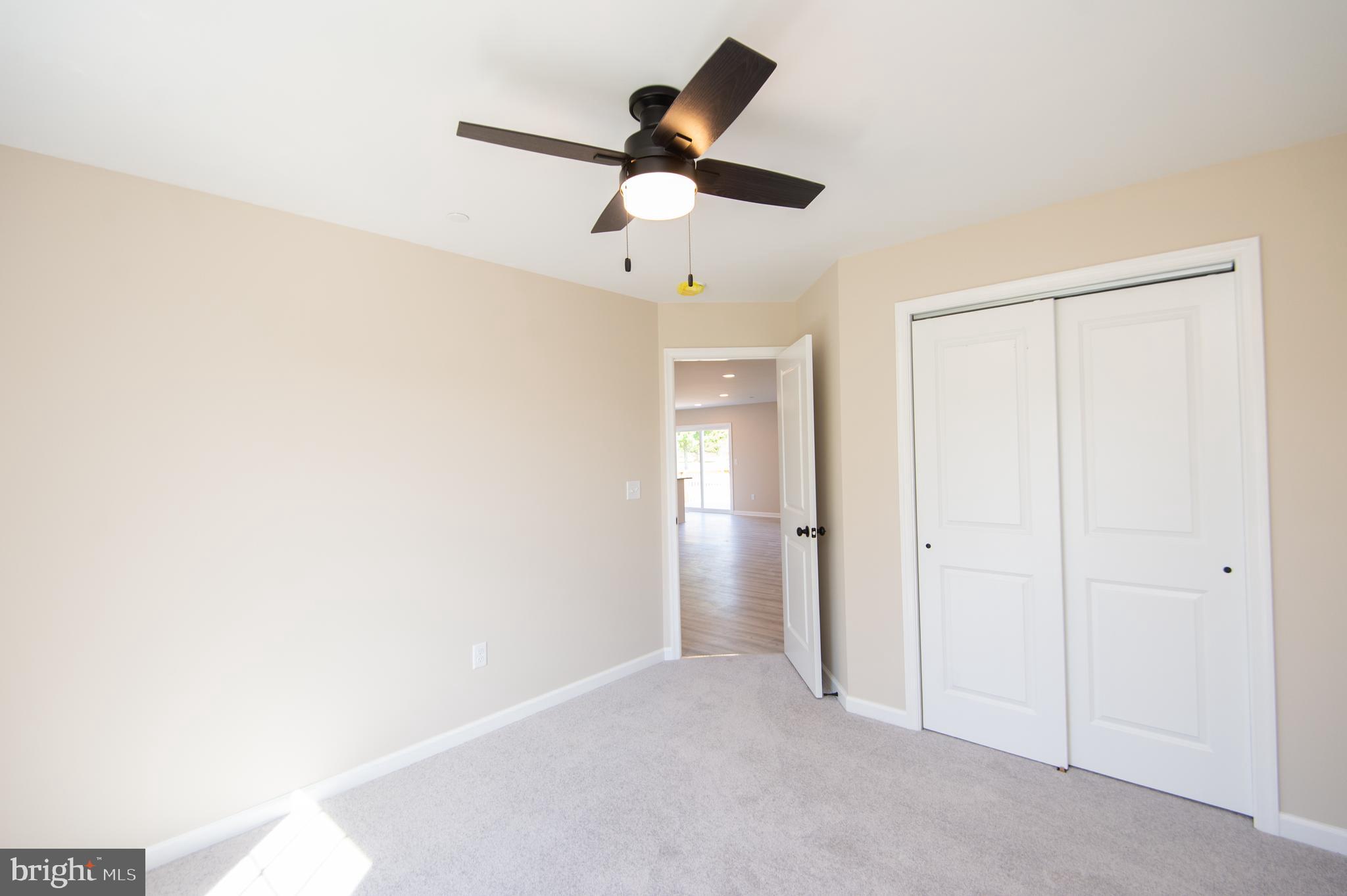 Wrights Rest Road Hurlock, MD 21643 - Photo 15 of 25 a view of empty room with ceiling fan
