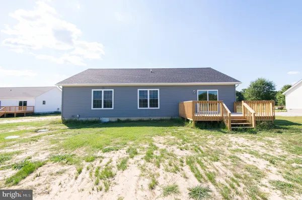 a view of a house with backyard porch and sitting area