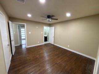 1570 Sutter Street Dallas, TX 75216 - Photo 5 of 17 an empty room with wooden floor and windows