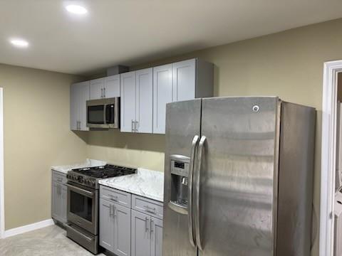 1570 Sutter Street Dallas, TX 75216 - Photo 10 of 17 a metallic refrigerator freezer sitting in a kitchen