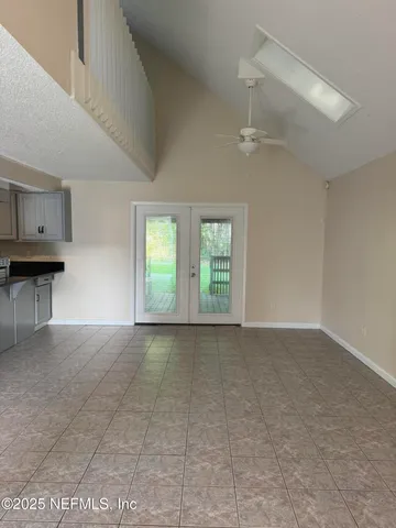 a kitchen with granite countertop a sink appliances and cabinets