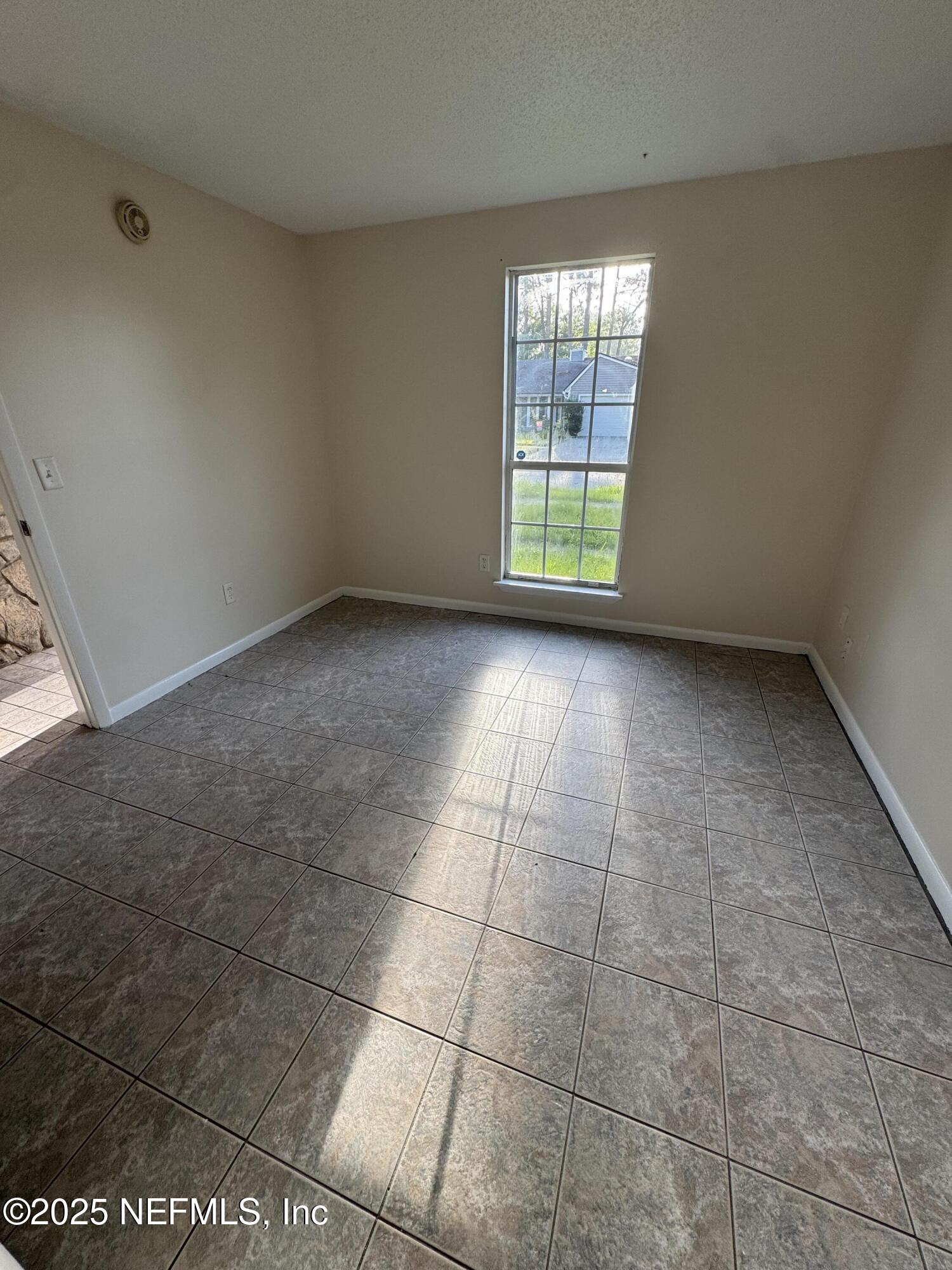 10244 Pine Breeze Road South Jacksonville, FL 32257 - Photo 7 of 16 an empty room with windows