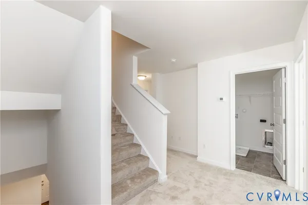 a view of a hallway with two rooms