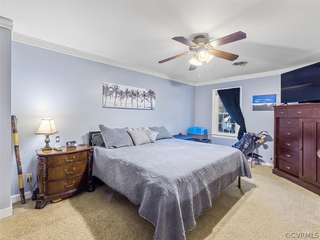 13813 Barnes Spring Road Midlothian, VA 23112 - Photo 17 of 28 a bedroom with a bed and a chandelier