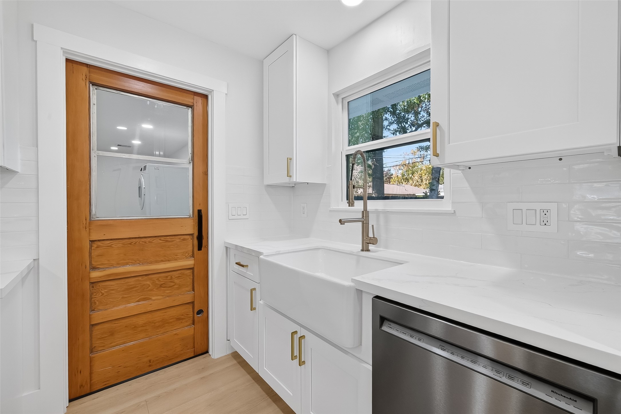 9770 Cedardale Drive Houston, TX 77055 - Photo 15 of 40 a kitchen with a sink and a window