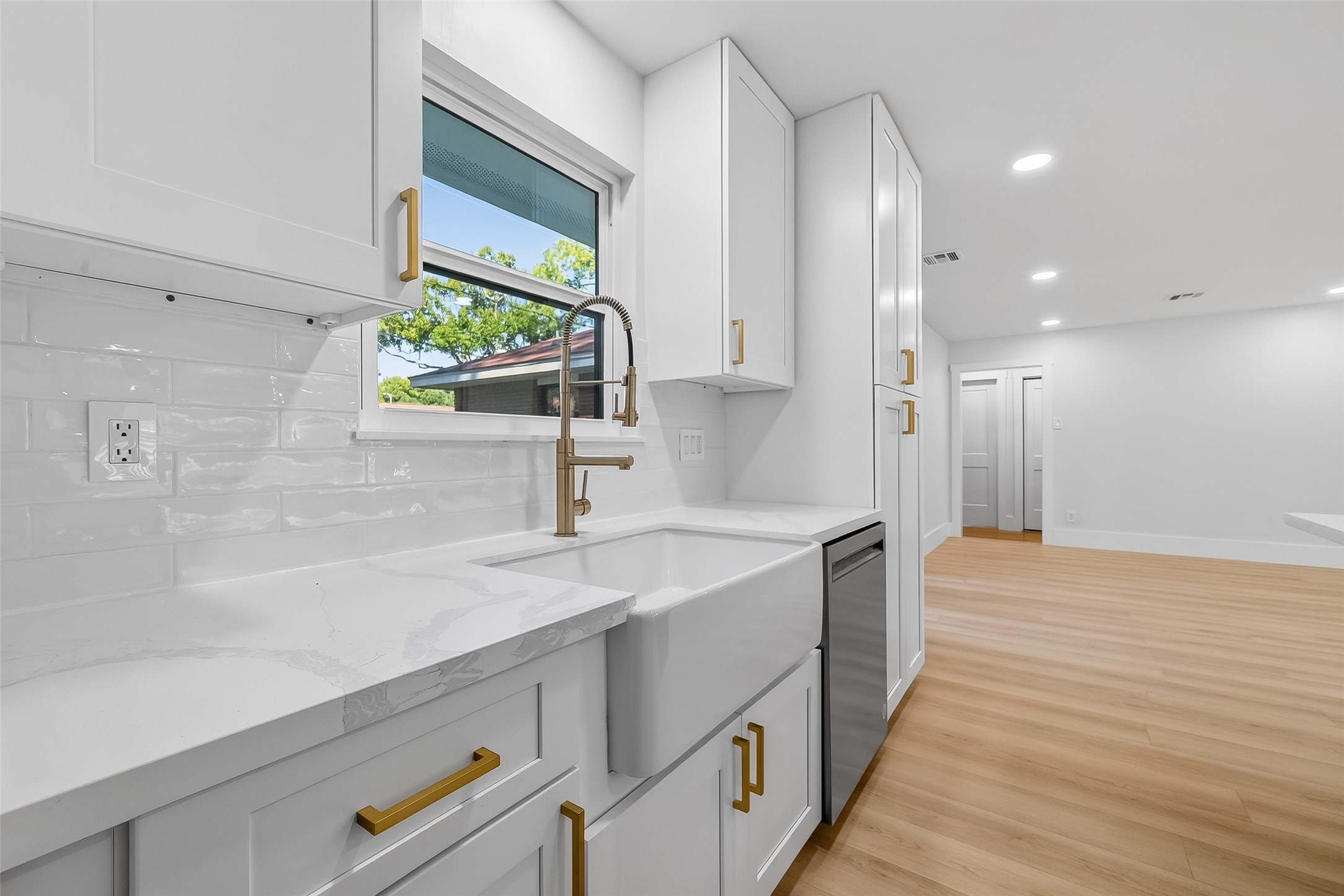 9770 Cedardale Drive Houston, TX 77055 - Photo 16 of 40 a kitchen with stainless steel appliances a sink stove and cabinets