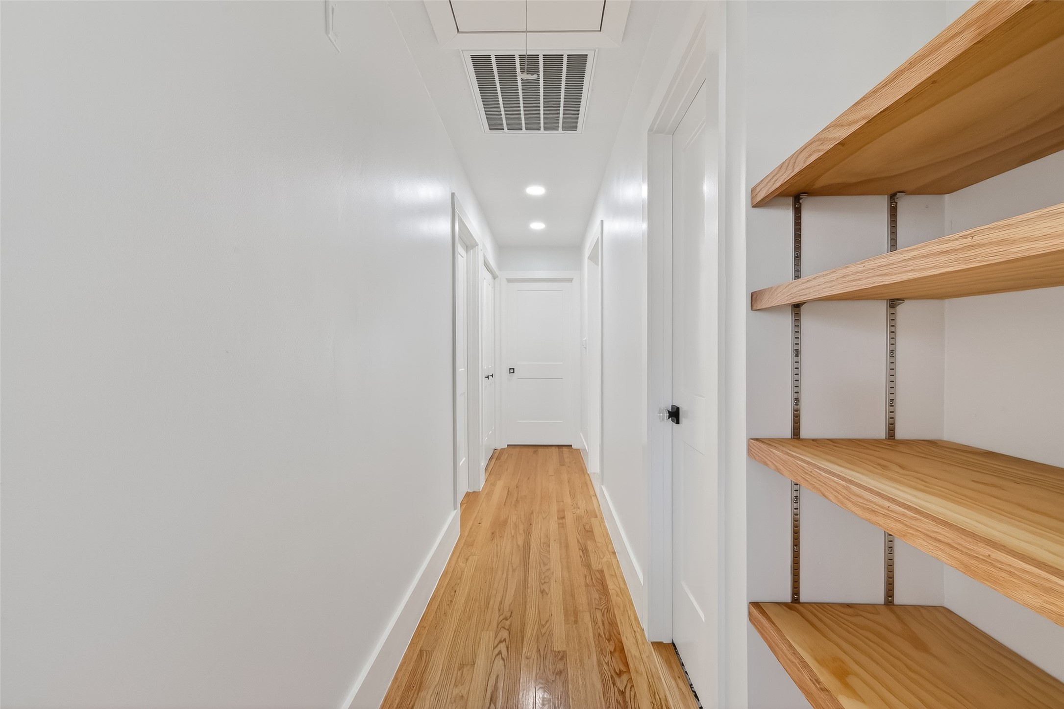 9770 Cedardale Drive Houston, TX 77055 - Photo 21 of 40 a view of a bedroom with wooden floor