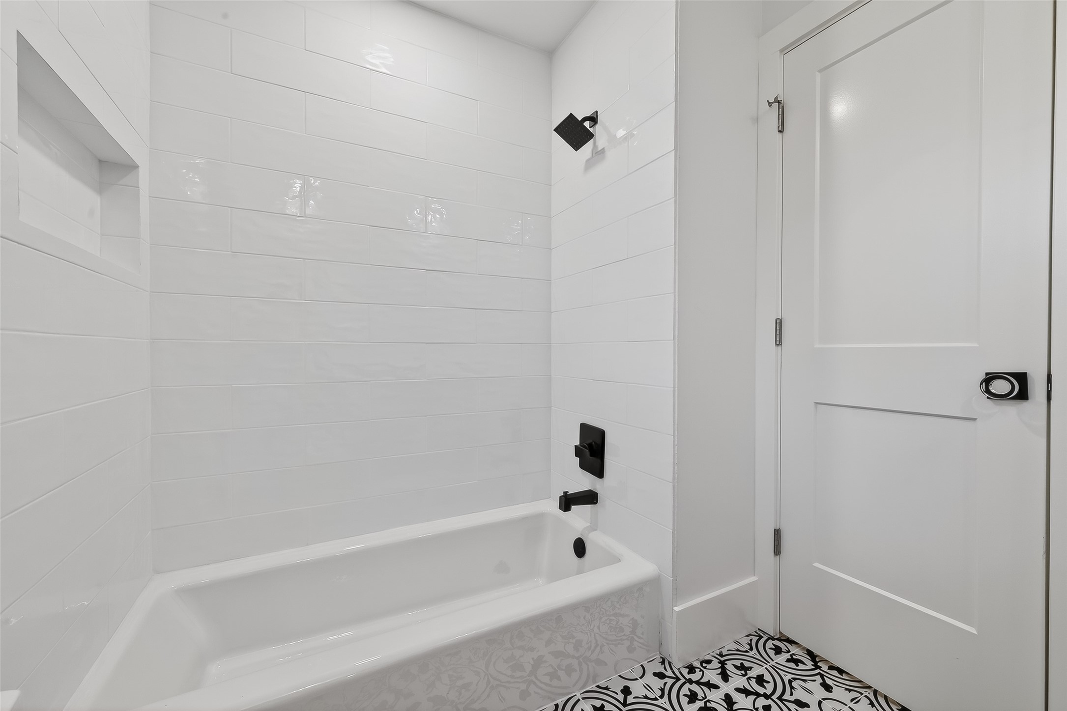 9770 Cedardale Drive Houston, TX 77055 - Photo 31 of 40 a bathroom with a bathtub and shower