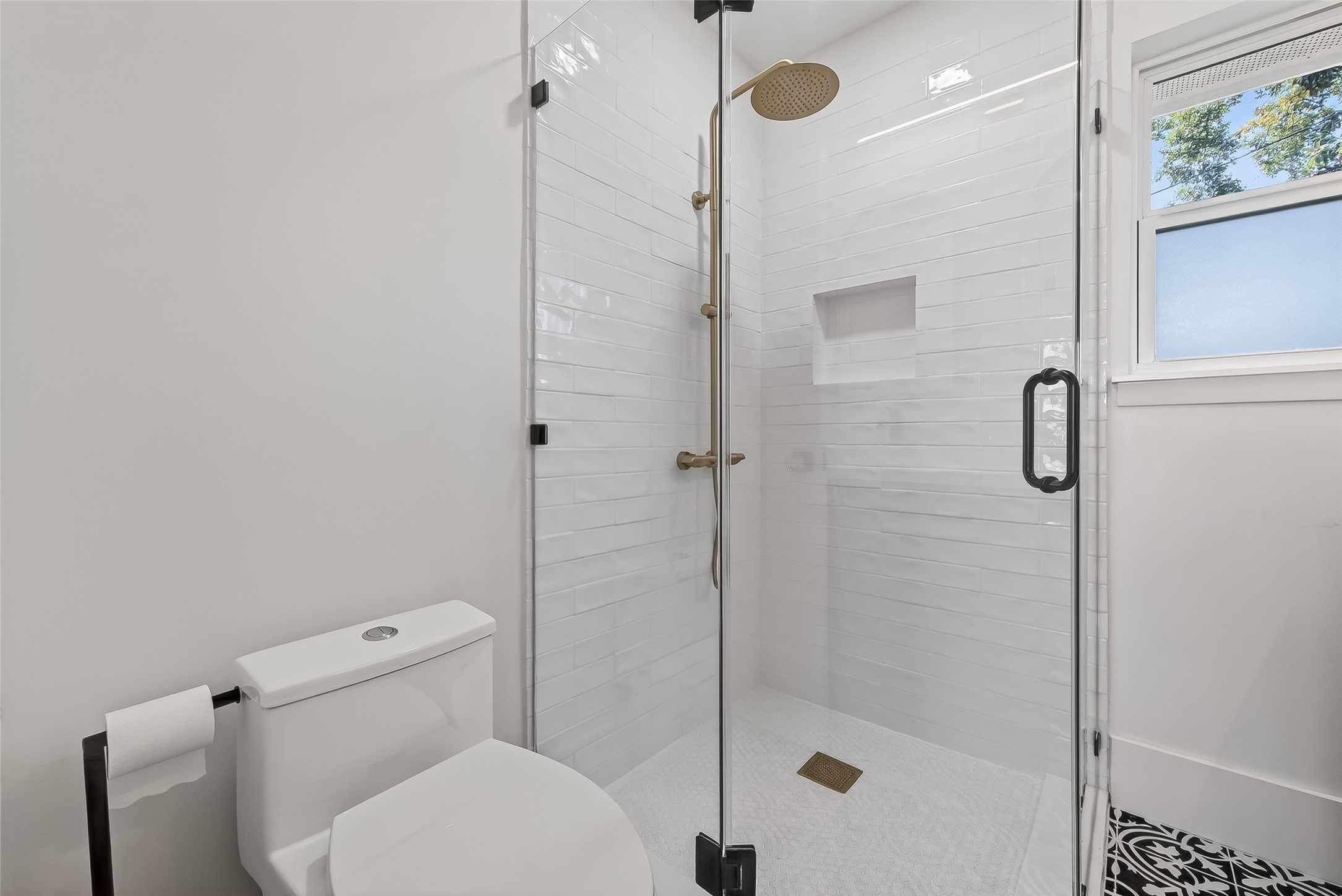 9770 Cedardale Drive Houston, TX 77055 - Photo 32 of 40 a bathroom with a shower and toilet