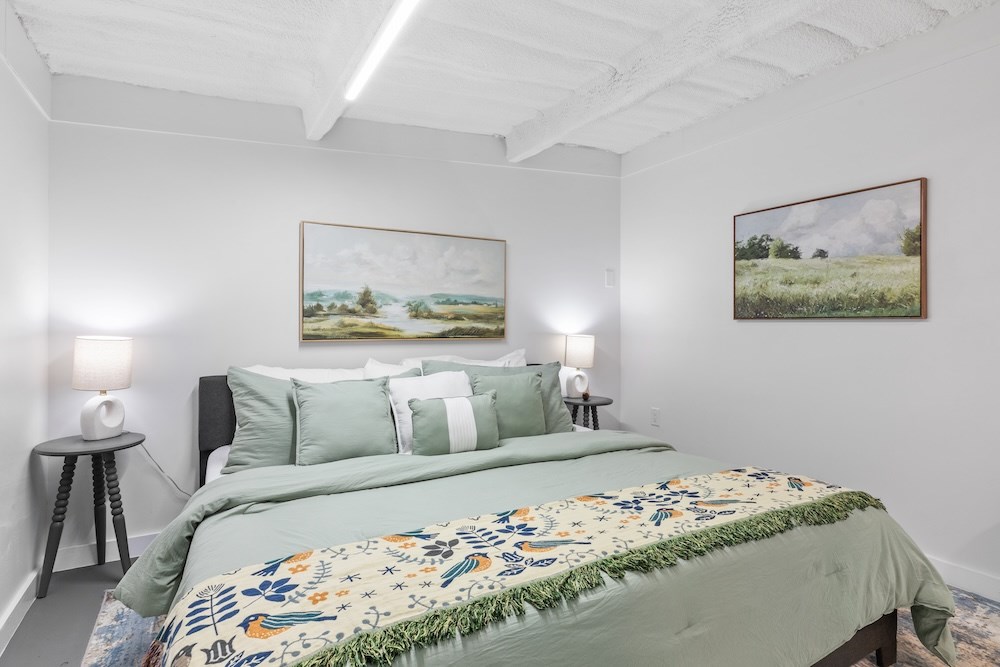 228-232 Spring Road Fredericksburg, TX 78624 - Photo 12 of 57 a bedroom with bed and cupboard