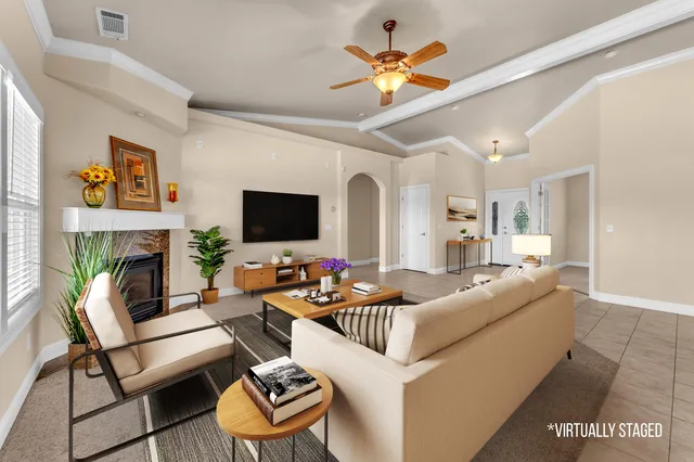 a living room with furniture and a flat screen tv