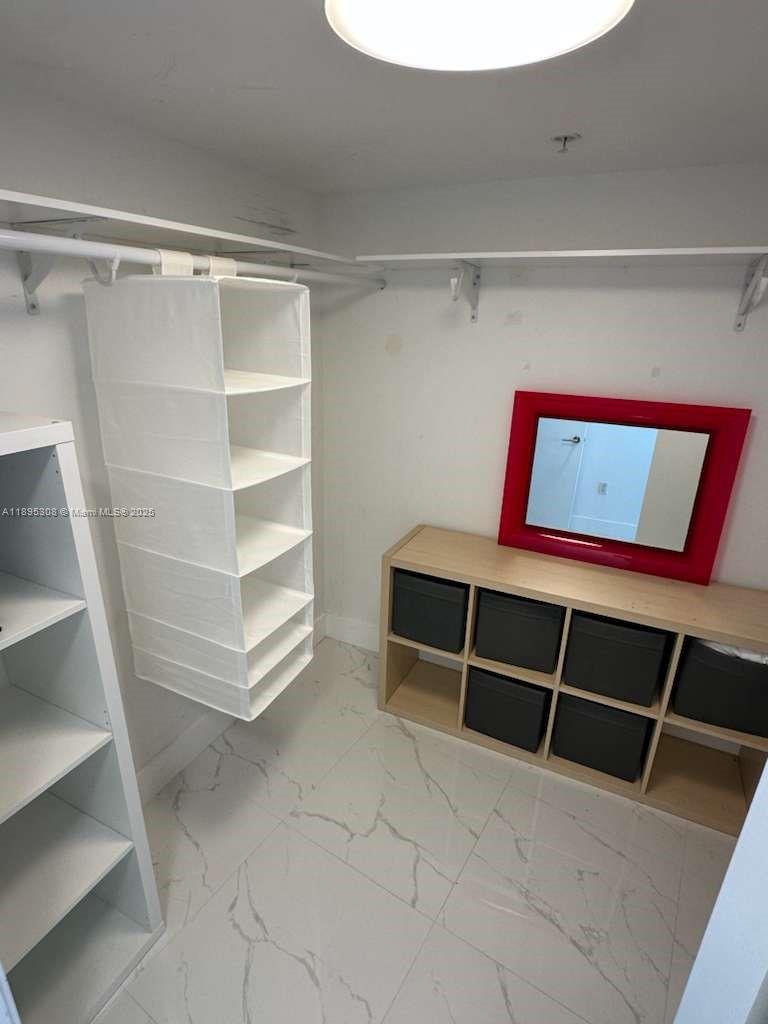6620 Indian Creek Drive, Unit 616 Miami Beach, FL 33141 - Photo 12 of 19 a view of an empty walk in closet