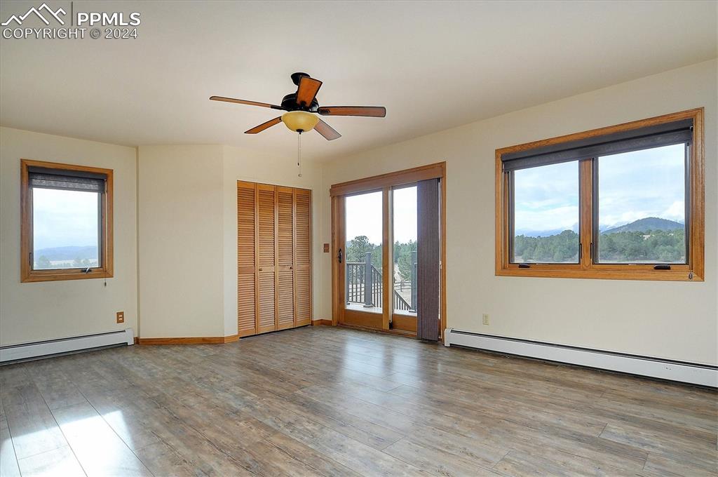1204 Hitching Post Road Cotopaxi, CO 81223 - Photo 13 of 49 a view of empty room with wooden floor and fan