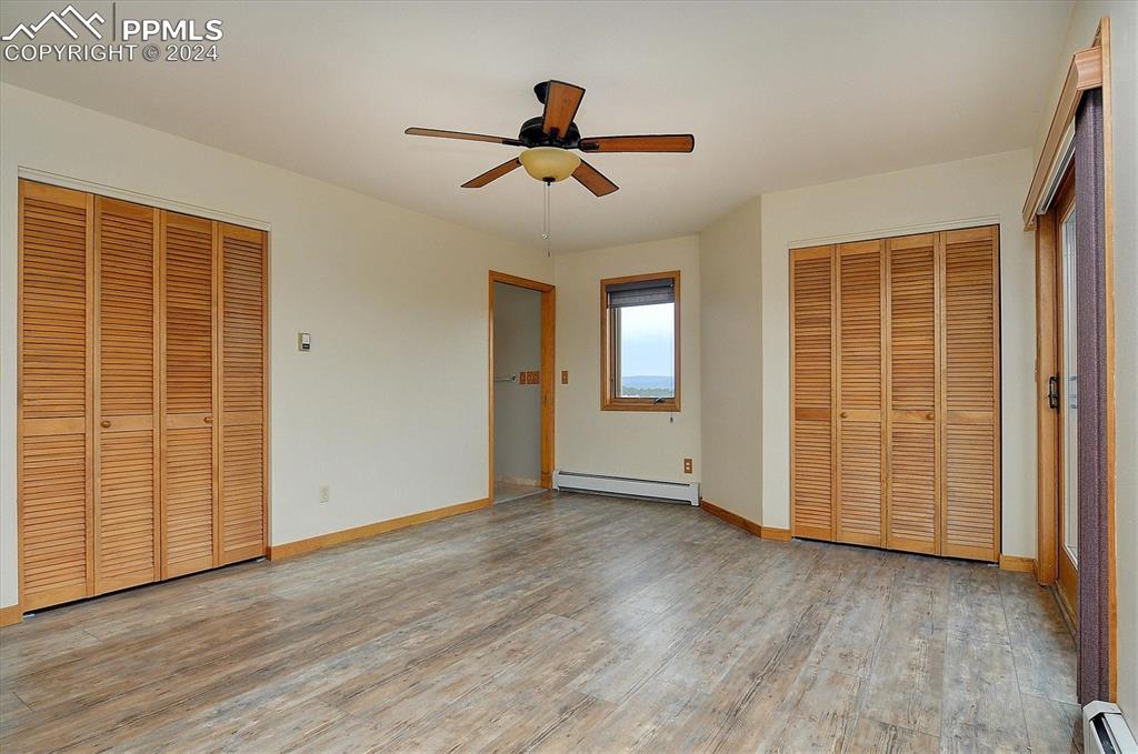 1204 Hitching Post Road Cotopaxi, CO 81223 - Photo 15 of 49 an empty room with wooden floor and windows