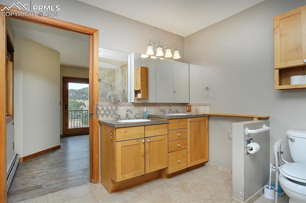 1204 Hitching Post Road Cotopaxi, CO 81223 - Photo 16 of 49 a bathroom with a sink and a mirror