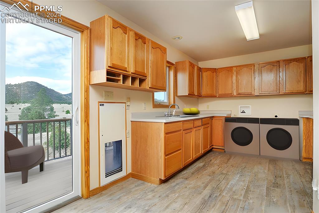 1204 Hitching Post Road Cotopaxi, CO 81223 - Photo 24 of 49 a kitchen with stainless steel appliances granite countertop a stove a sink and a refrigerator with wooden floor