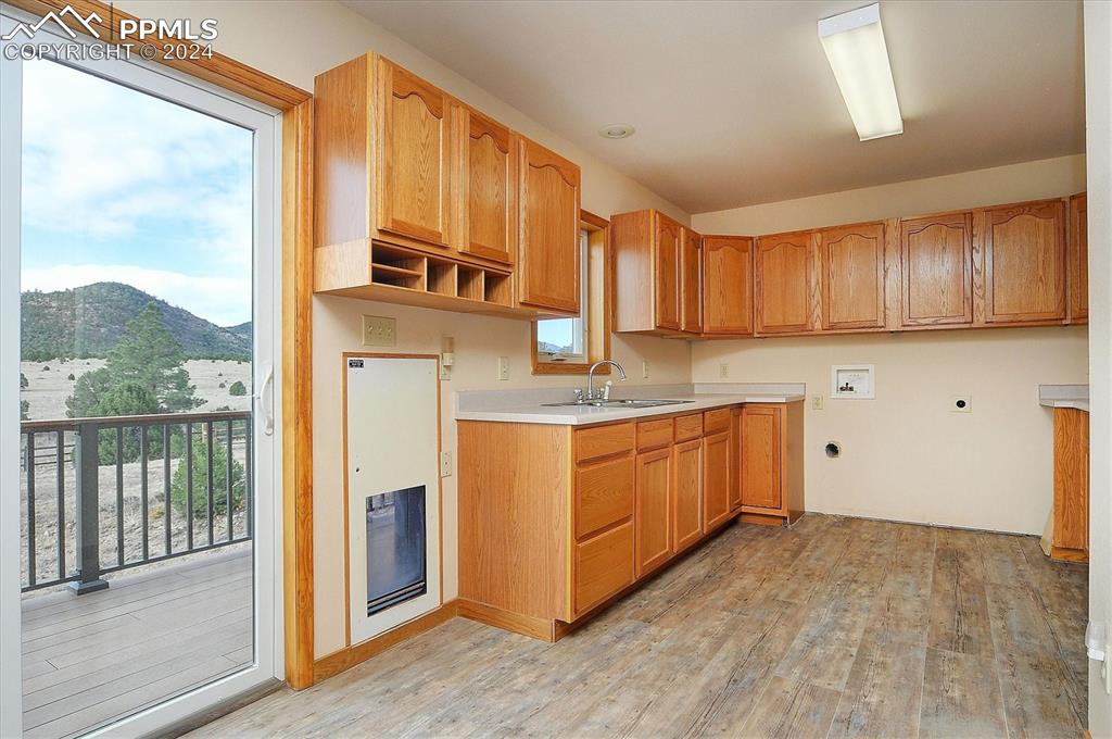 1204 Hitching Post Road Cotopaxi, CO 81223 - Photo 25 of 49 a kitchen with granite countertop a stove a sink and a refrigerator