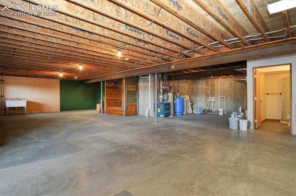 1204 Hitching Post Road Cotopaxi, CO 81223 - Photo 32 of 49 a view of an empty room with wooden floor and a window
