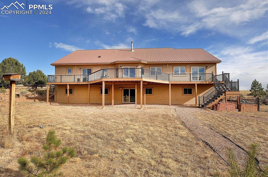 1204 Hitching Post Road Cotopaxi, CO 81223 - Photo 40 of 49 a front view of a house with a yard