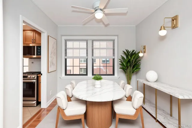 a bathroom with a white bath tub a sink and a window