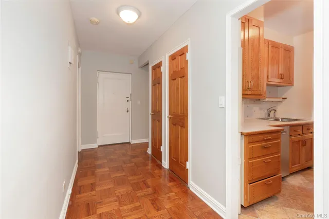 a view of a hallway with a wooden floor