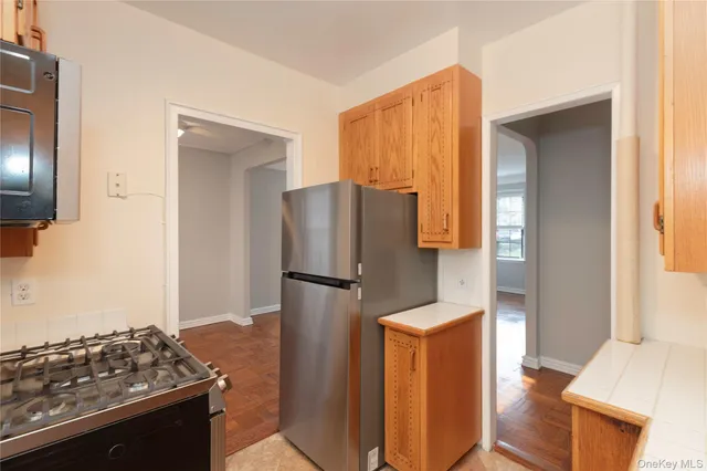 a kitchen with stainless steel appliances granite countertop a sink and cabinets