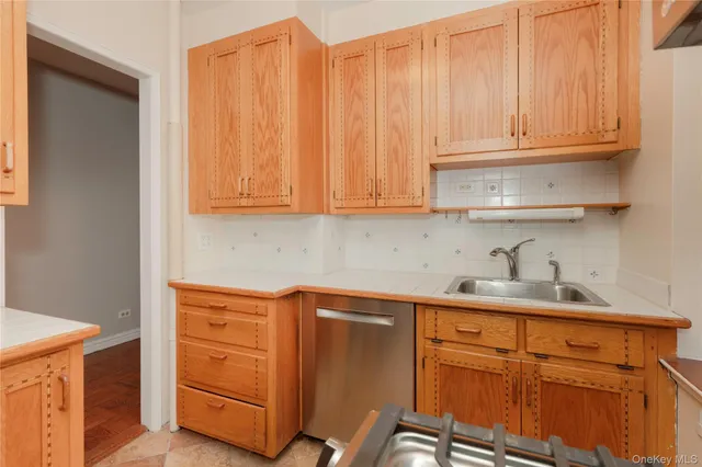 an empty room with windows and ceiling fan view