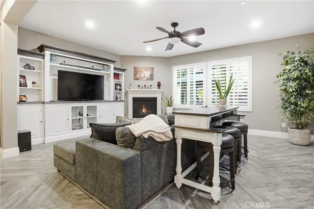 a kitchen with stainless steel appliances granite countertop a sink a stove and a wooden cabinets