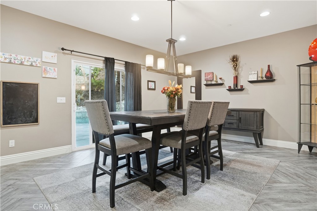 25654 Red Hawk Road Corona, CA 92883 - Photo 21 of 75 a view of a dining room with furniture window and wooden floor