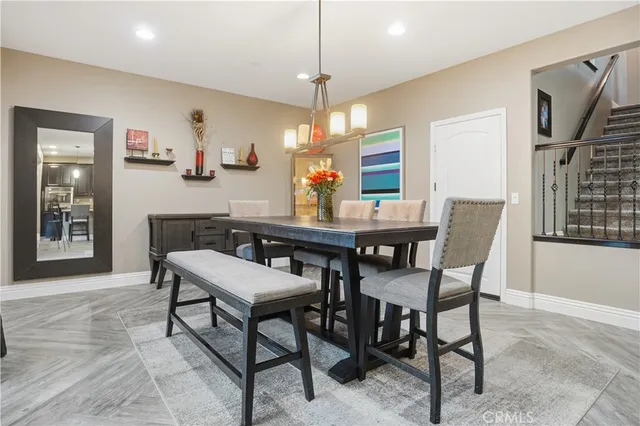 a bathroom with a tub a sink and a large mirror
