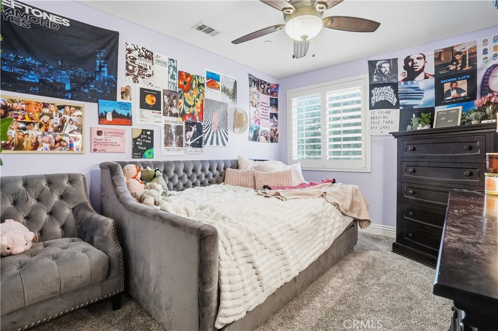 25654 Red Hawk Road Corona, CA 92883 - Photo 33 of 75 a bed room with a bed and a couch